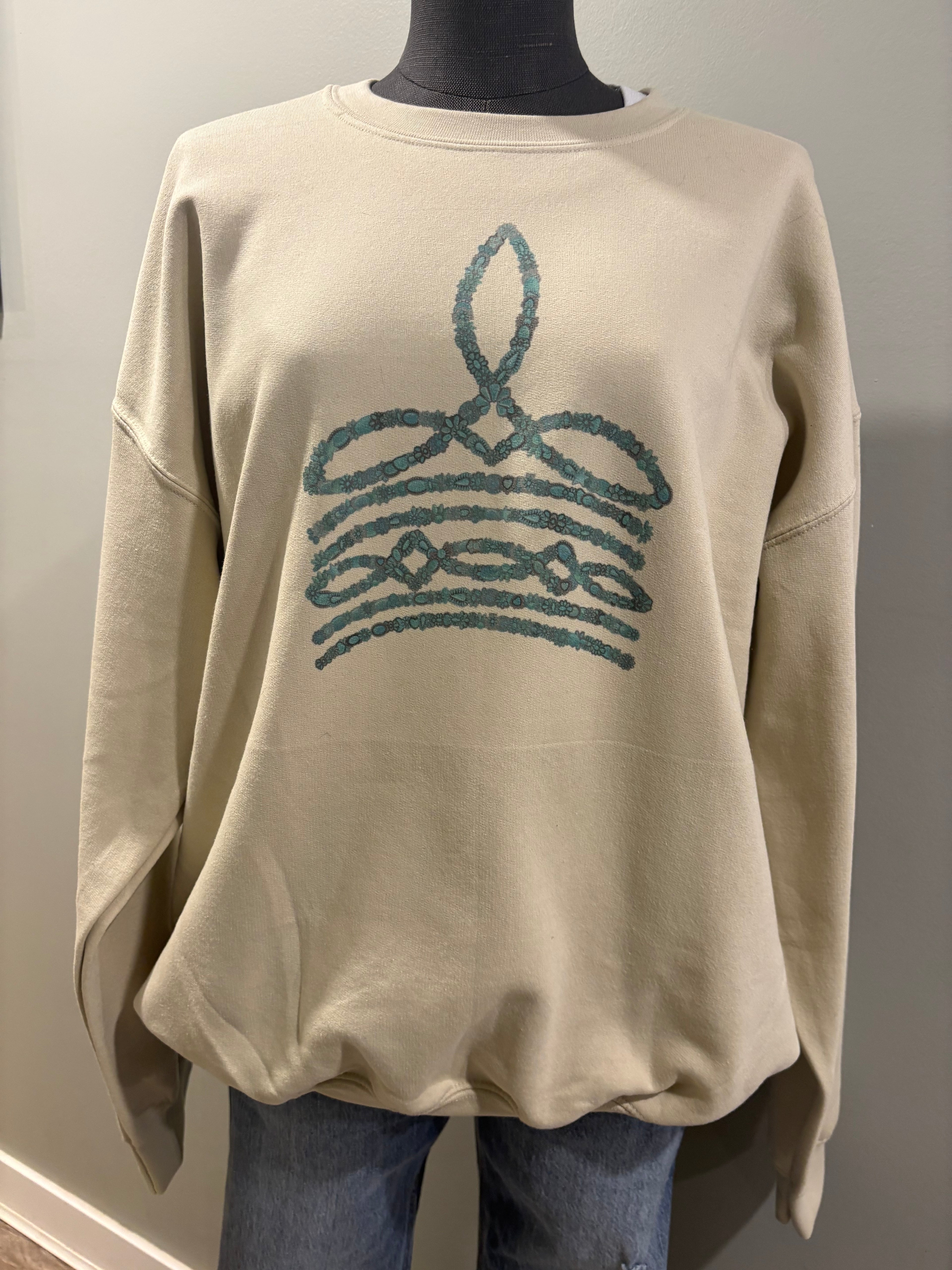 Turquoise boot stitch sand crewneck sweater with western-inspired design